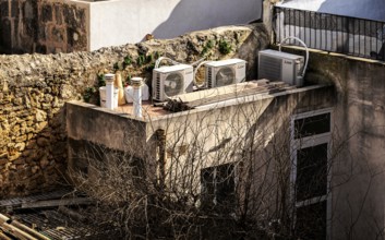 View of Mediterranean houses, roofs and courtyards from the town wall, Alcudia, Majorca, Spain,