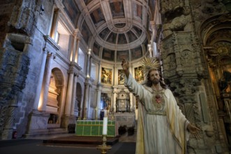 Interior view, statue of a saint, choir, altar, monastery church Igreja Santa Maria de Belém,