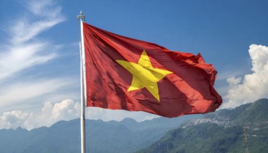 Flags, the national flag of Vietnam flutters in the wind