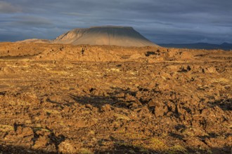 Large lava field and volcanic crater in the midnight sun, clouds, mood, Burfellshraun, Myvatn,