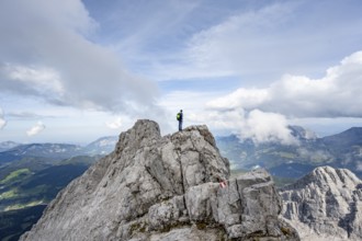 Mountaineer on a narrow rocky ridge, Watzmann crossing to Watzmann Mittelspitze, view of mountain