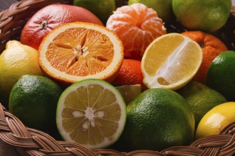 Assortment, citrus fruits, in a basket, close-up, top view, no people