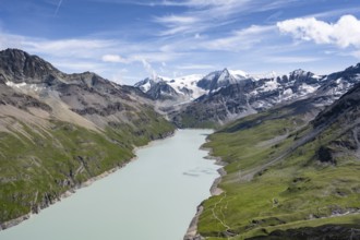 Picturesque mountain landscape, view of a blue mountain lake, Lac des Dix reservoir, behind