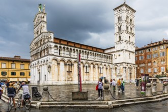 Rain clouds over the church and Piazza San Michele, historic city centre, Lucca, Tuscany, Italy,
