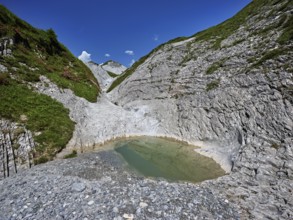 Glacier mill with glacier pots on the Trinser Alp Mora, Trin, Canton Graubünden, Switzerland,
