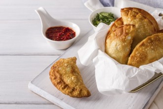 Fried chebureks, close-up, on a white background, no people