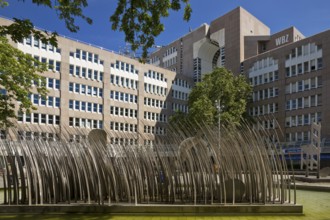 Stainless steel figure group on Bertha-von-Suttner-Platz entitled The Island by Horst Antes,