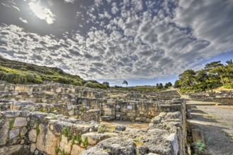 HDR, Ancient ruins with overgrown stone walls under a cloudy sky, historical site, Hellenistic