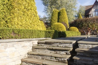 Cottage garden with stone stairs and retaining wall, Modern landscape design