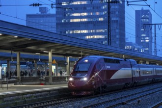 Eurostar train, train traffic, city centre skyline, Essen central station, North Rhine-Westphalia,