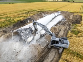 Demolished tower of a 20 year old wind turbine, in the Werl wind farm, 5 old Enercon E-66 turbines