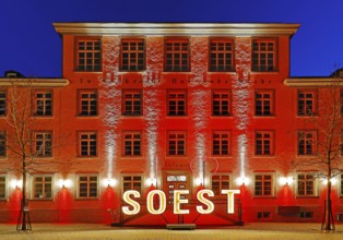 Illuminated town hall in the evening at the Winterstrahlen Festival of Lights in Soest, North