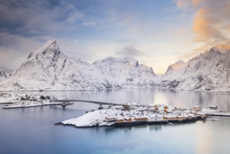 View of snow-covered islands, fjord and mountains, fishing village Sakrisøy, Reine, Reinefjord,