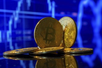 Close-up of symbolic bitcoins