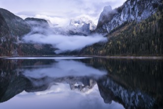 The Vordere Gosausee lake in autumn with a view of the Dachstein mountain range. The Gosaukamm on