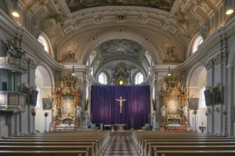 Interior with large purple Lenten cloth in front of the high altar, baroque parish church of St