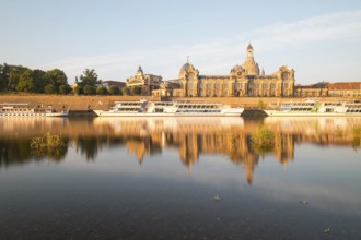 Silhouette of the Old Town with reflection in the Elbe in the morning, steamboats on the