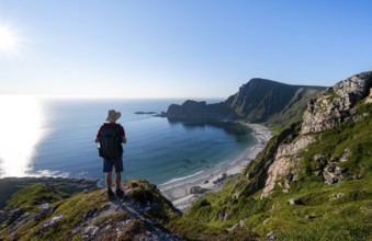 Mountaineer, view of coastal landscape, steep coast with summit Måtind or Måtinden, Høyvika beach