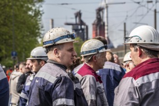 Steelworkers at a demonstration in front of the headquarters of ThyssenKrupp Steel Europe in