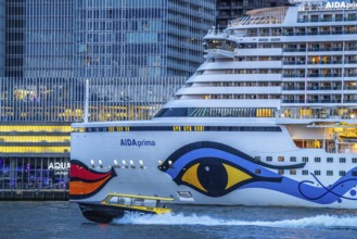Cruise ship Aida Prima at the Cruise Terminal of Rotterdam, Kop van Zuid, skyscrapers at the