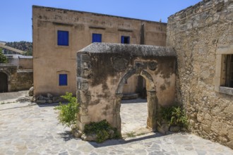 View of old historical Tor tor behind building with blue shutters of Ethnological Museum, Vori,