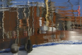 Reflection, colourful reflections on the water surface, maritime impressions, Greetsiel, North Sea,
