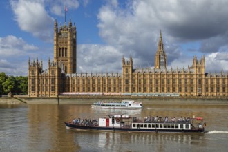 Excursion boats on the Thames at the Houses of Parliament, London, England, Great Britain