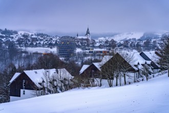 The snow-covered town view of Winterberg at dusk, Sauerland, North Rhine-Westphalia, Germany,