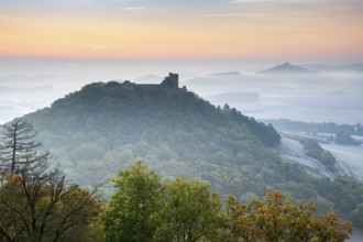 View of the ruins of Gleichen Castle at sunrise in autumn, Wachsenburg Castle in the background,