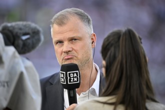 Chief Sports Officer Fabian Wohlgemuth VfB Stuttgart in front of TV camera in interview Microphone