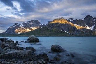 Landscape with sea and mountains on the Lofoten Islands, view over the fjord Flakstadpollen to