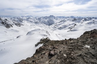 Mountain panorama with view of peaks of the Bernina group, ascent to Piz Grialetsch in winter,