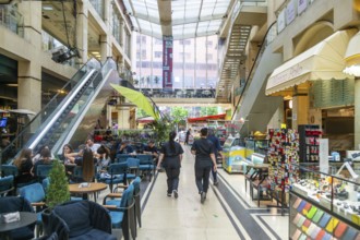 Shops and people inside shopping mall Galeria 17 Nëntori in city centre, Tirana, Albania, Europe