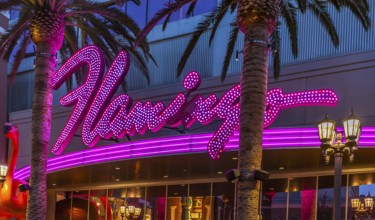 Purple and pink neon lights of the Flamingo Las Vegas Hotel and Casino on the Las Vegas Strip in