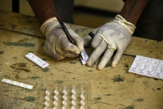 A health worker working before Covid-19 Rapid Antigen Testing (RAT), at a Swab collection centre