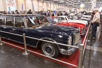 Visitors to Techno Classica take a look at a Mercedes Benz 600. Techno Classica is the trade fair