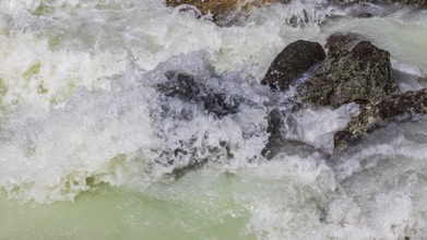 Dark boulders in a glacial stream, near Grimentz, Val d'Anniviers, Valais Alps, Canton Valais,