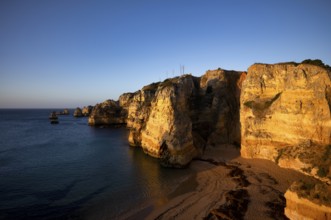 Colourful cliffs and rocks at sunrise on the beach, Praia da Dona Ana, Lagos, cliffs, Atlantic