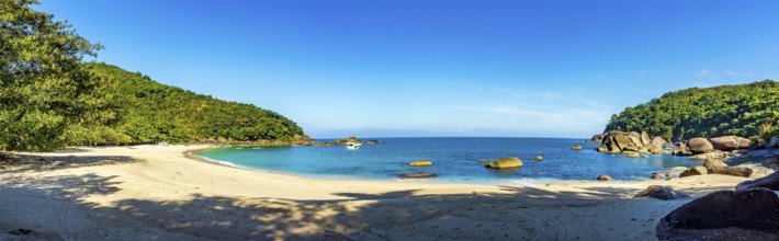 Panoramic image of the paradisiacal beach of Indaiauba on the island of Ilhabela, Indaiauba beach,