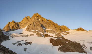 Rocky mountain peak, summit of the Aiguille de Tour in the evening light at sunset, Chamonix,