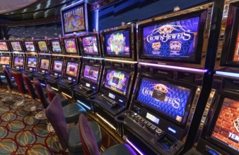 Seattle, USA, 18 September 2022: Casino gambling blackjack and slot machines waiting for gamblers