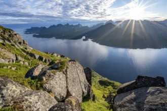 View of Fjord Raftsund and mountains in the evening light, sun star, view from the top of