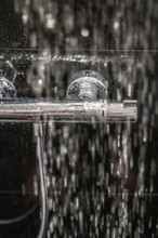 Shower, fitting, temperature control, temperature control of the shower water