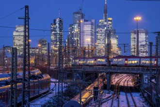 Railway tracks in front of the main railway station in Frankfurt am Main, skyline of skyscrapers in