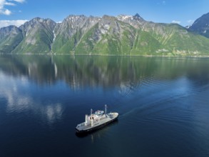 Ferry Trandal-Standal arrives at Standal, aerial view, fjord Hjoerundfjord, Norway, Europe