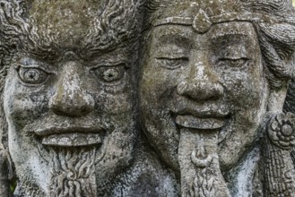 Temple figure, couple, woman, man, Hinduism, tongue, long, outstretched, facial expression, stone,