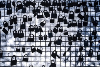 Padlocks, so-called love locks on a fence, vantage point in Wesel am Rhein, North Rhine-Westphalia,