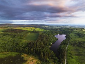 Sunset over Cod Beck Reservoir from a drone, North York Moors National Park, North Yorkshire,