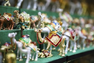 Souvenir camels in the souk or soug or market in the old town of Nizwa, ad-Dachiliyya region, Oman,