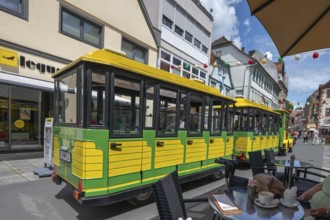 Tourist train runs through the town centre of Bad Kissingen, Lower Franconia, Bavaria, Germany,